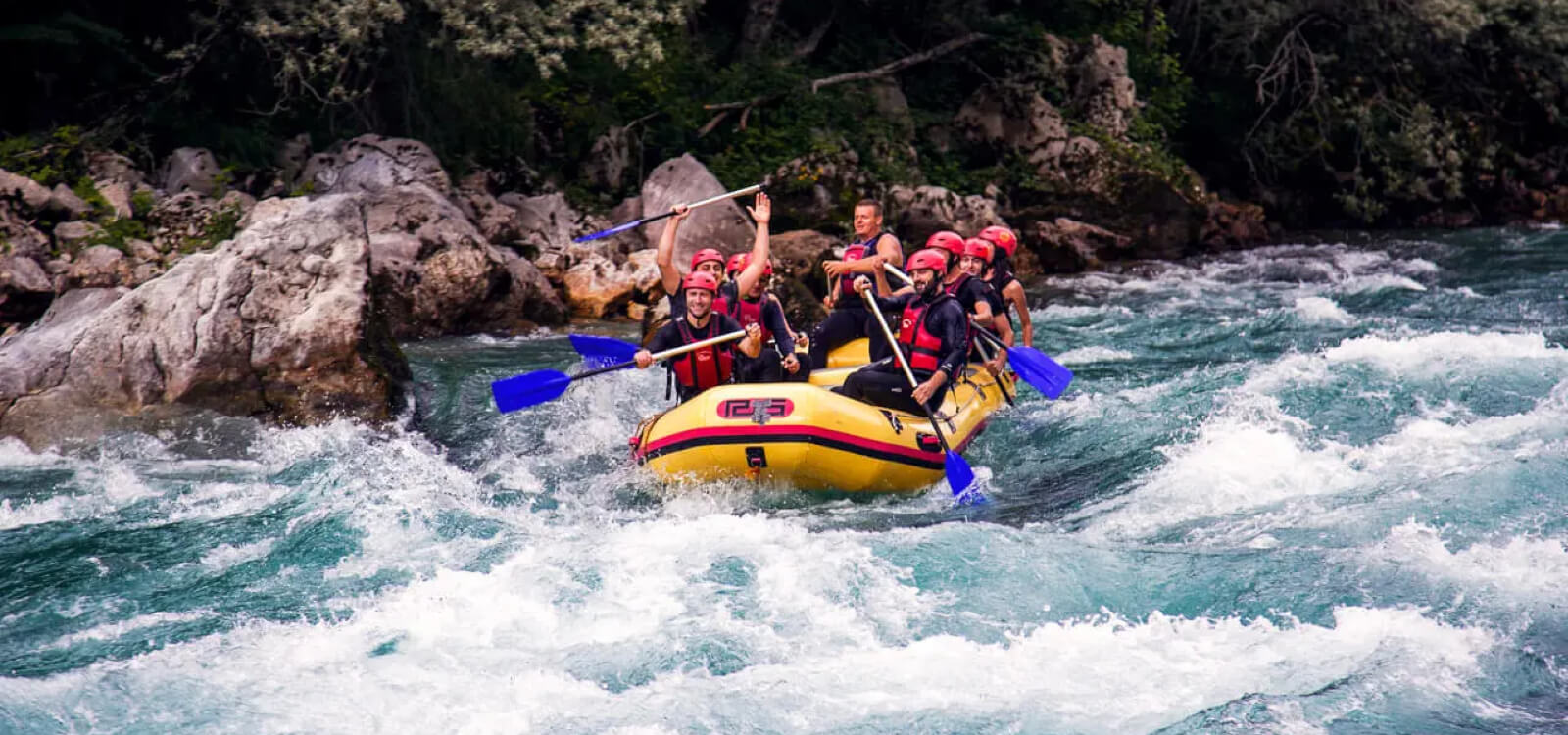 visitors doing river rafting in river around Pacifc inn - best riverside resort in rishikesh