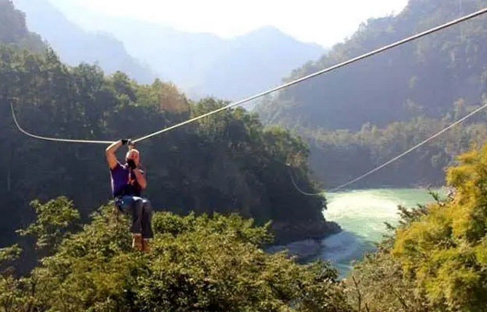 People enjoying zipline in rishikesh