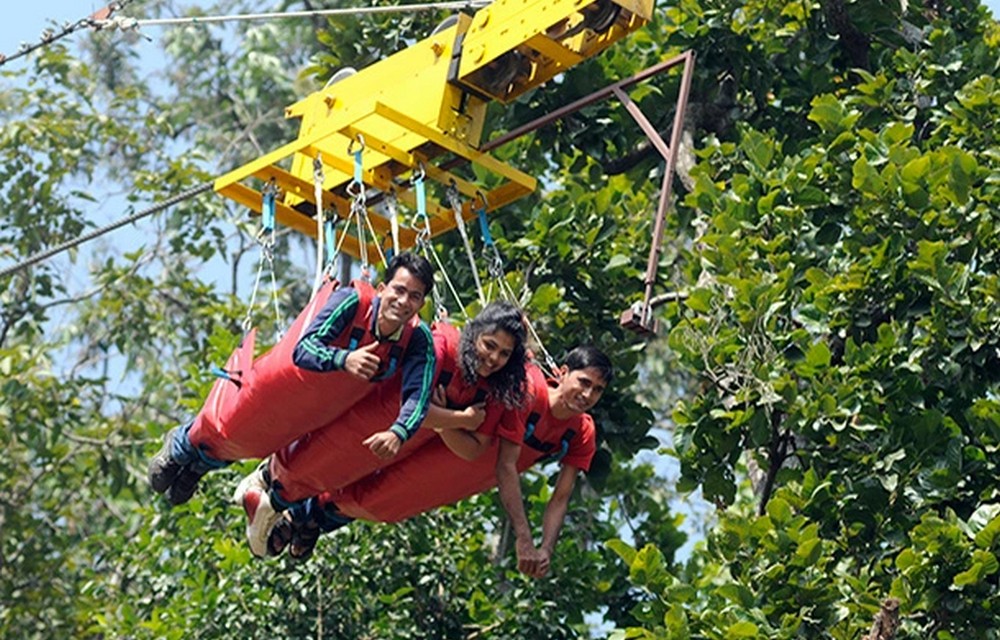 people enjoying flying fox in rishikesh